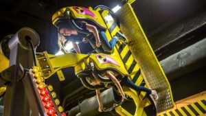 teens aboard 360 Bikes ride at Wonderworks in Branson, Missouri, USA